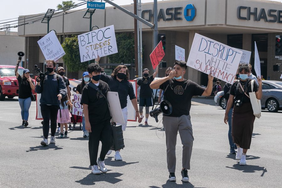 Colored Minds Inc. protesters block the intersection of Reseda Boulevard and Nordhoff Street in Northridge, Calif., on Saturday, April 17, 2021, to bring attention to their cause.