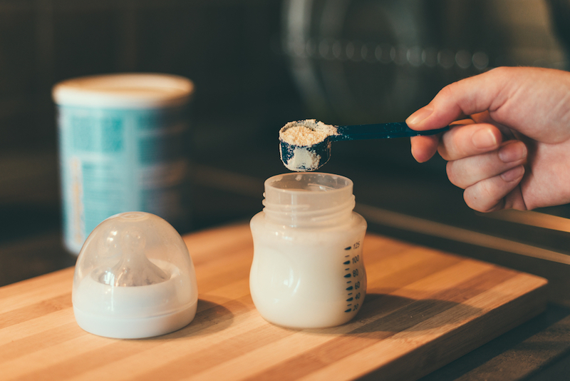 Making baby formula in milk bottle
