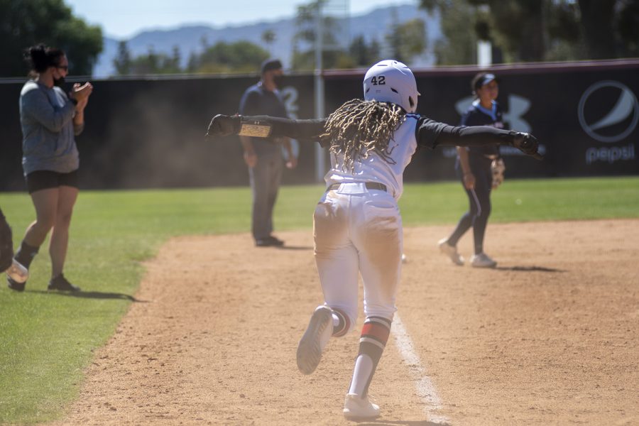 Jaymi Steward runs toward her teammates to celebrate their win against the University of San Diego at the Matador Diamond in Northridge, Calif. on Wednesday, April 28, 2021.