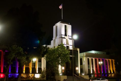 Glendale City Hall glows with the colors of the Armenian Flag — red, purple and gold — in Glendale, Calif. on April 23, 2021.