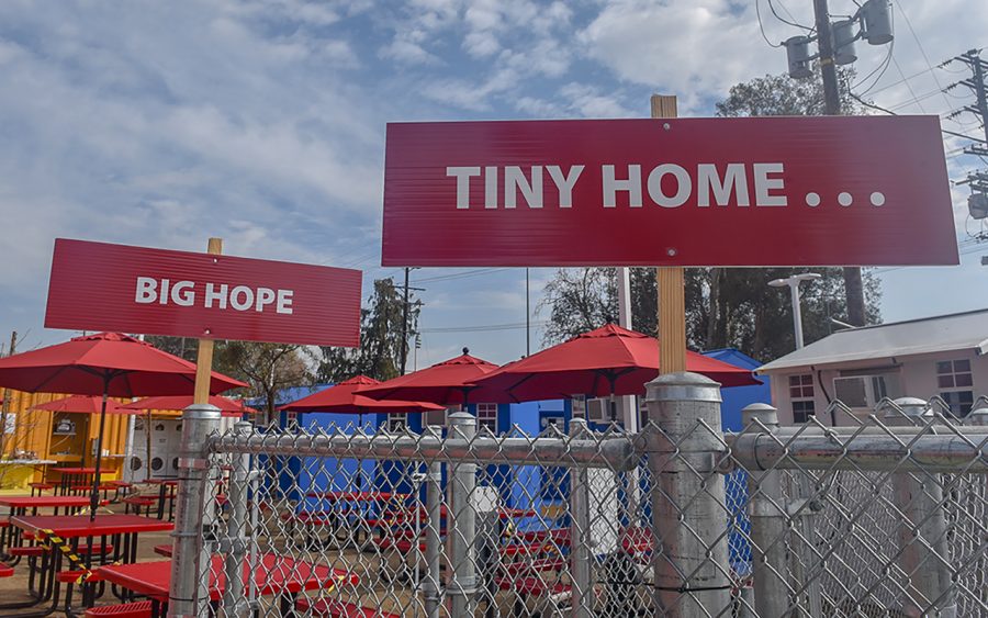 Signs lined up along the Hope of the Valley Rescue Mission Tiny Home homeless shelter in North Hollywood, Calif., on Tuesday, Feb. 9, 2021.