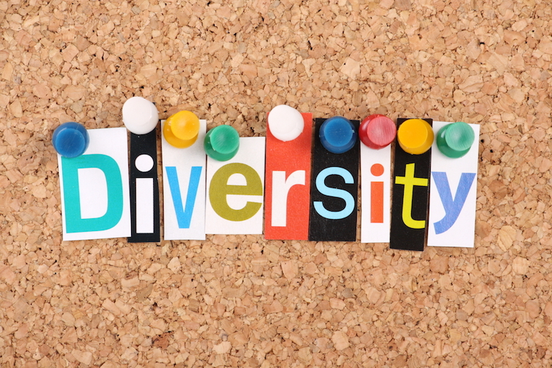 The word Diversity in cut out magazine letters pinned to a cork notice board