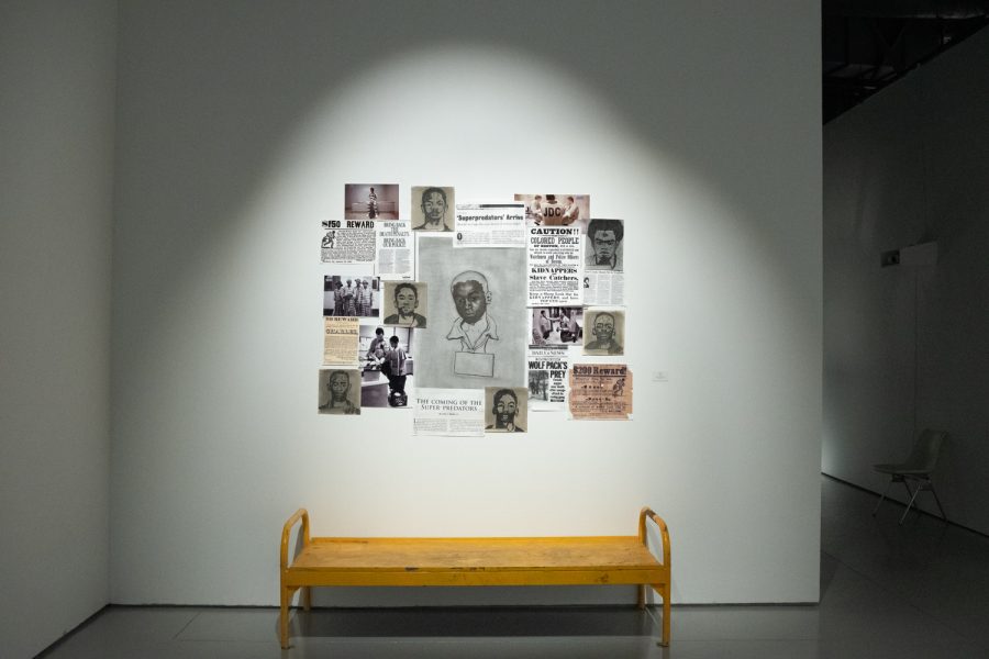 Charcoal on paper, archival digital prints and a prison bed are shown in the piece The Pipeline, by Micheal Roman in the 2020 and 2021 graduation exhibition In, On, and Around, at the CSUN Art Gallerys main gallery in Northridge, Calif., Monday, Oct. 25, 2021.