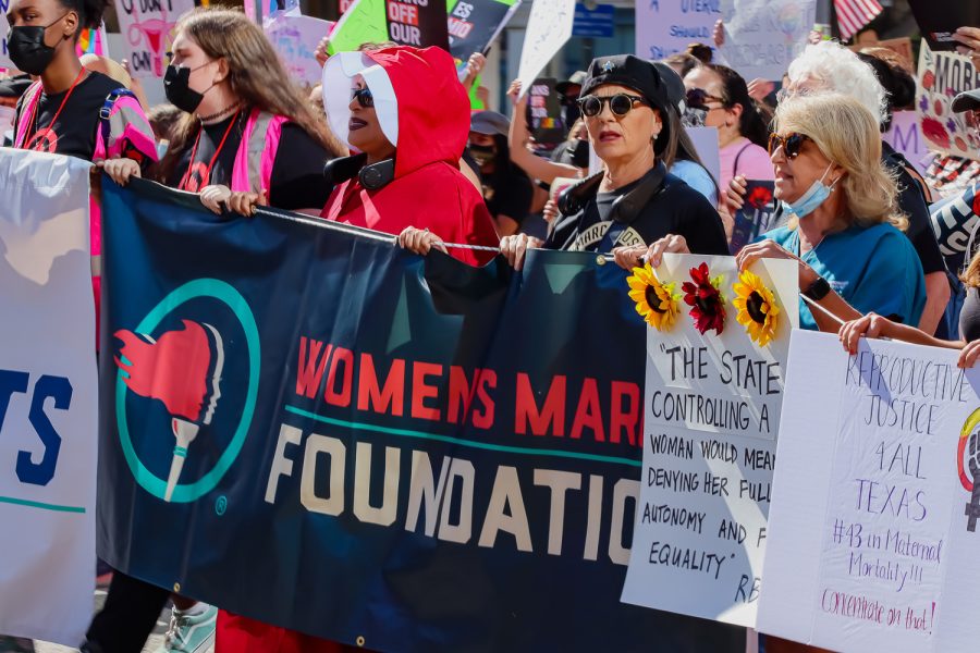 The+crowd+walks+toward+City+Hall+at+the+march+for+women%E2%80%99s+reproductive+rights+organized+by+Women%E2%80%99s+March+in+downtown+Los+Angeles%2C+Calif.%2C+on+Oct.+2%2C+2021.