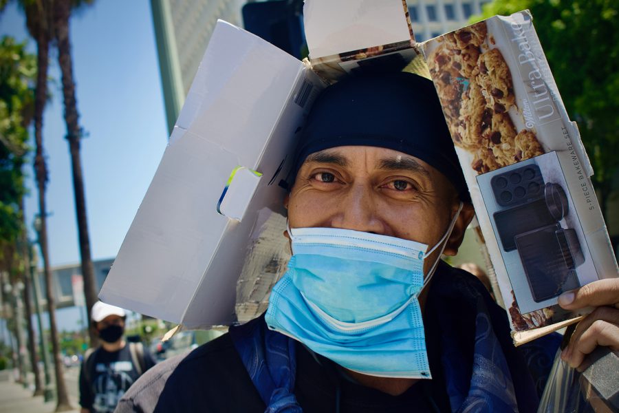 A member of the unhoused community marches during a rally in Downtown Los Angeles, Calif. on Wednesday, July 28 2021. Protesters consisting of both housed and unhoused persons marched side by side, calling on LA City Council Members and Mayor Eric Garcetti to vote against a proposed amendment to LA Municipal Code 41.18, which aims to criminalize individuals who sit, lie or sleep on public property within specified times and locations.