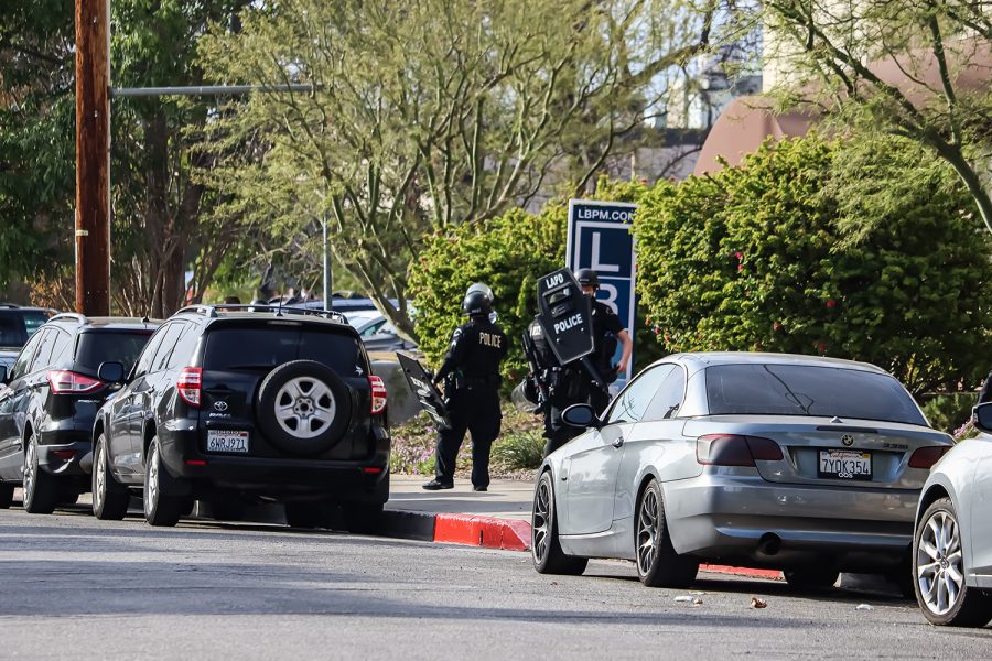 Officers in riot gear responded to a domestic incident on Dearborn Street in Northridge, Calif., on Thursday, Nov. 18, 2021.
