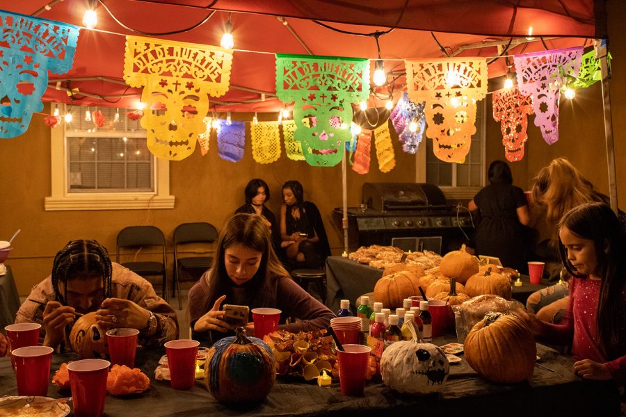 Attendees painting pumpkins at the Día de los Muertos bash and fundraiser in North Hollywood, Calif., on Friday, Oct. 29, 2021.