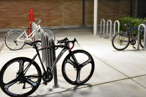 Bikes locked up at the bike stands outside the Student Recreation Center at CSUN in Northridge, Calif., on Thursday, Nov. 18, 2021.