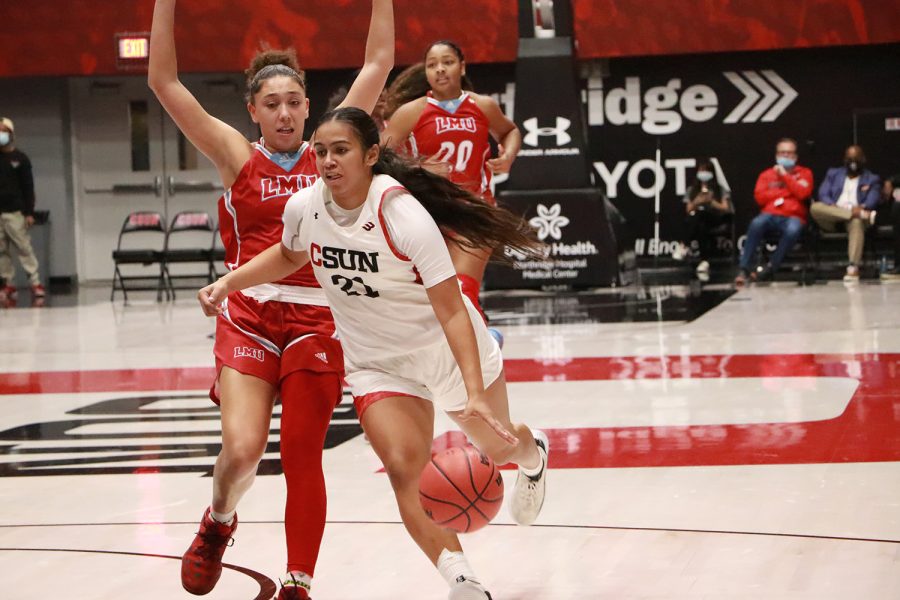 CSUN womens basketball player with the ball