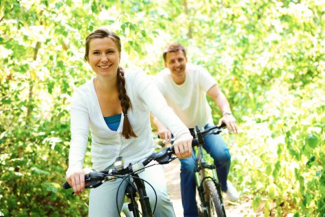 woman and man riding bikes outdoors