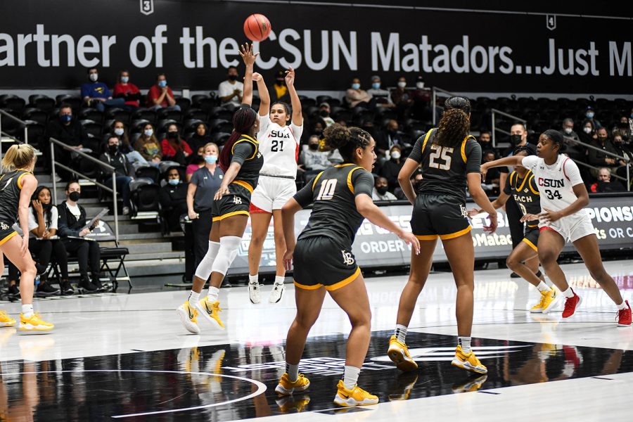 Anaiyah Tu'ua (21) shoots for the basket as Long Beach State plays defense at CSUN's The Matadome on Jan. 15, 2022, in Northridge, Calif.
