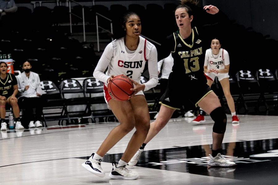 CSUN+guard+Sydney+Woodley+looks+for+a+hole+in+the+Cal+Poly+defense+on+Feb.+12%2C+2022%2C+at+The+Matadome+in+Northridge%2C+Calif.
