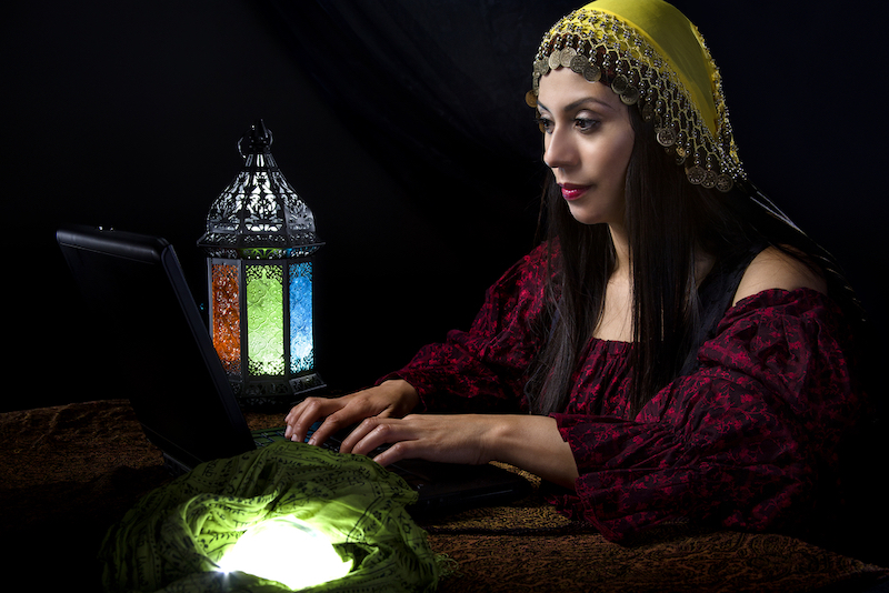 Fortune Teller blogging about her predictions with a computer online