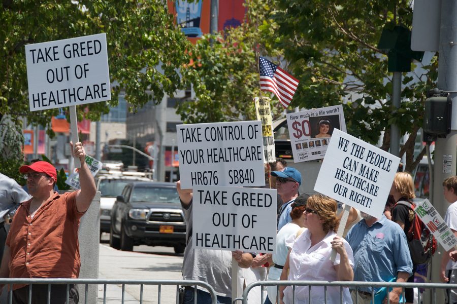 Protesters stand outside the health insurance conference at Moscone Center West during the summer of 2008 in San Francisco, Calif.
