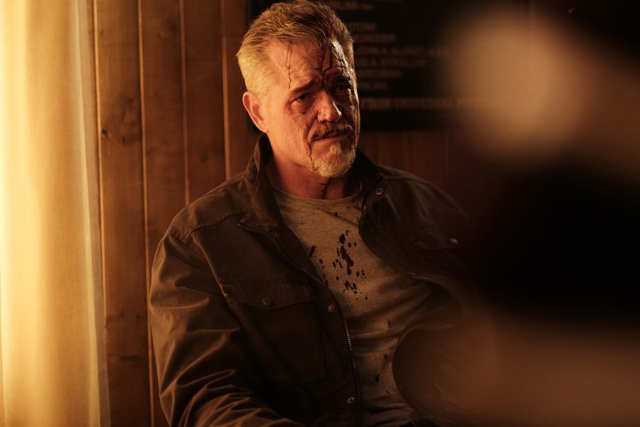 Eric Dane in Season Two of Euphoria. Sitting down and with blood on his face