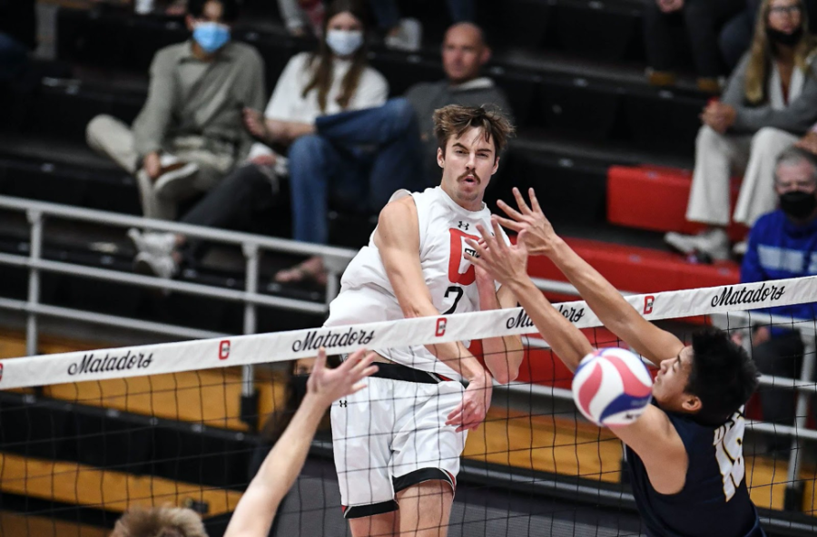Kyle Hobus (7) delivers a spike against No. 5 UC Santa Barbra, who beat CSUN in three sets on Friday, March 11, 2022, at The Matadome in Northridge, Calif.