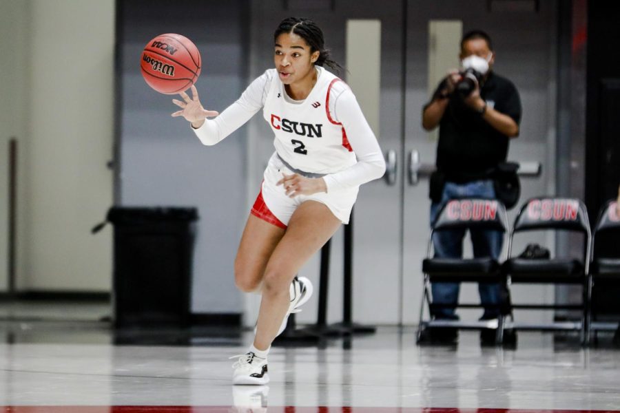 Sydney Woodley dribbles up the court at The Matadome during a CSUN home game in Northridge, Calif., on Jan. 29, 2022.