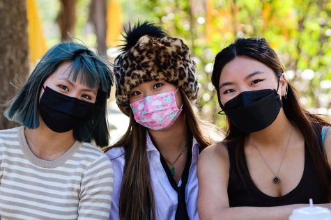 (From left) Yvette Tran, Leona Do and Rachel Hur sit on the outdoor patio of the CSUN Arbor Grill in Northridge, Calif., on Feb. 8, 2022. Tran finished up her class and joined the other two in the discussion about their views on online dating.