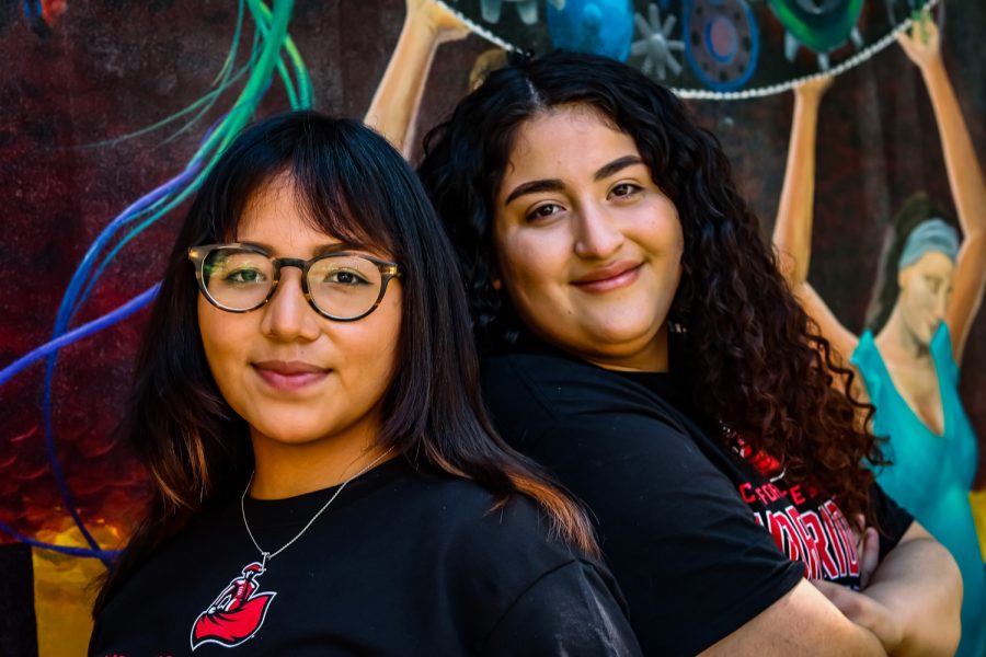 Portrait of Jessica Flores Rodriguez and Yoselin Deleon in front of the mural on the Casita behind the Chicana Studies building at CSUN taken on Mar. 18, 2022, in Northridge, Calif.