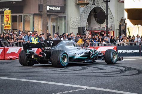 Mercedes-AMG Petronas Formula One driver Valtteri Bottas lines up to do donuts in his F1 car during the F1 Hollywood Festival on Hollywood Boulevard in the Hollywood neighborhood of Los Angeles, Calif., on Oct. 30, 2019.