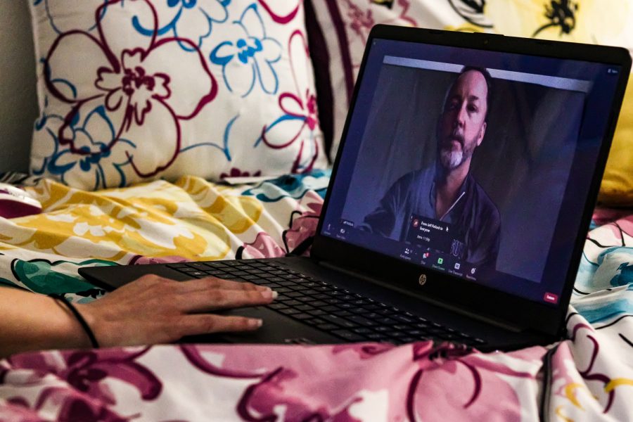 CSUN deaf studies major Juliette Braden takes an online ASL development class with Jeff Pollock on March 29, 2022, in her dorm room in Northridge, Calif. The Zoom continued to freeze throughout the class so they needed to communicate in the chat box.
