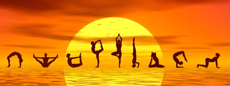 Silouhettes+of+people+doing+yoga+asanas+by+sunset