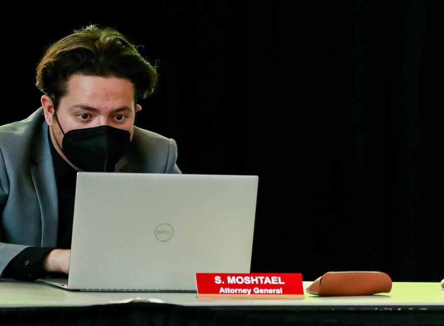 A man facing a computer
