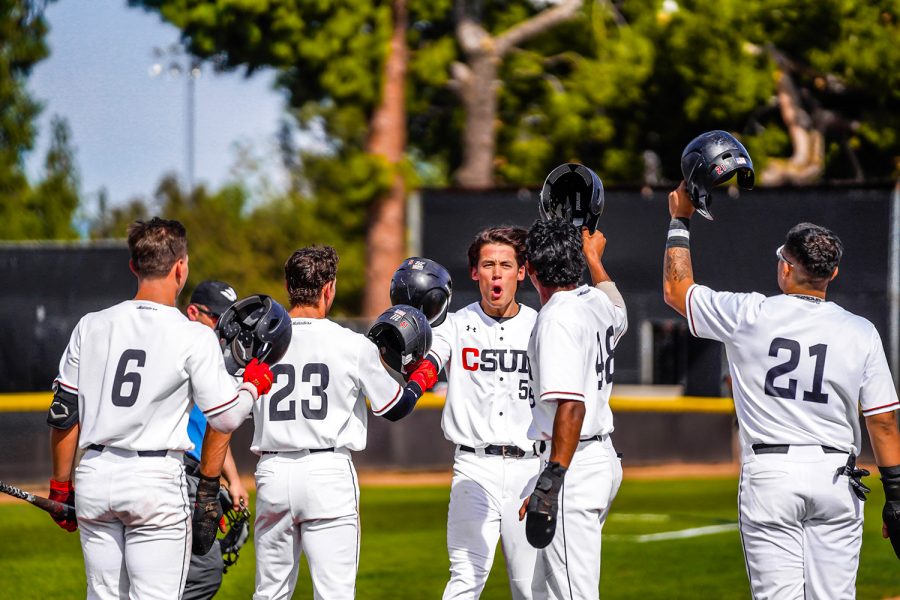 CSUN+mens+baseball+players+celebrating+to+each+other