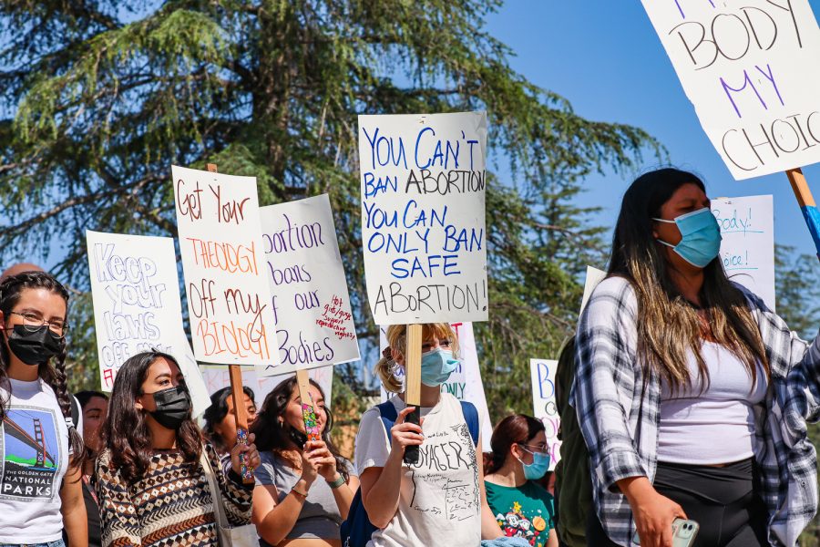 Students and gender and womens studys professors march on CSUNs campus in response to a leaked draft suggesting the Supreme Court overturning Roe v. Wade on Tuesday, May 3, 2022. The protest was organized by Shira Brown, the director of CSUNs Womens Research and Resource Center.