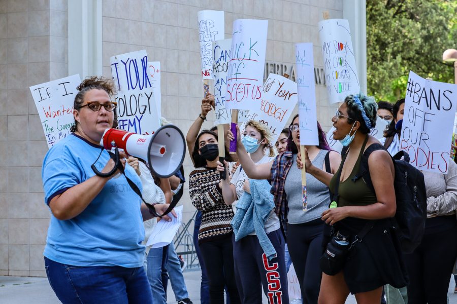Shira Brown, director of CSUNs Women’s Research and Resource Center, leads protestors in a chant during the demonstration in response to the draft opinion regarding Roe v. Wade on Tuesday, May 3, 2022, in Northridge, Calif.
