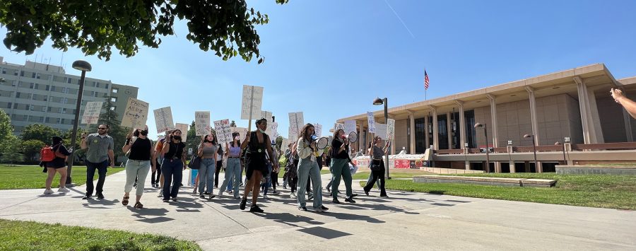 Protestors march in front of the University Library at CSUN in response to a leaked draft suggesting the Supreme Court will overturn Roe v. Wade on Tuesday, May 3, 2022. The protest was organized by the university's Women's Research and Resource Center, as well as Tina Beyene, assistant professor of CSUN’s Department of Gender and Women’s Studies.
