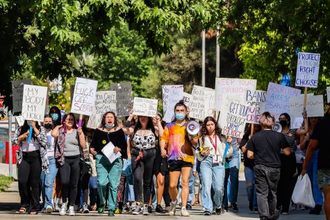 Students and gender and womens studys professors march on CSUNs campus in response to a leaked draft suggesting the Supreme Court overturning Roe v. Wade on Tuesday, May 3, 2022. The protest was organized by Shira Brown, the director of CSUNs Womens Research and Resource Center.