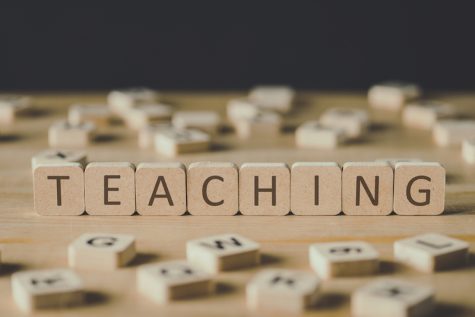 wooden letter blocks spelling the word Teaching