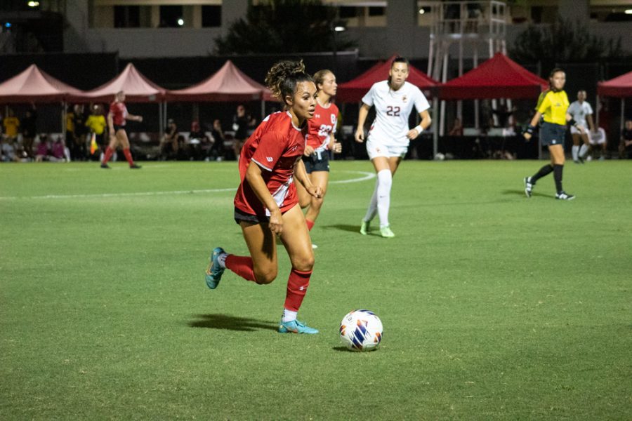 CSUN womens soccer player running with the ball