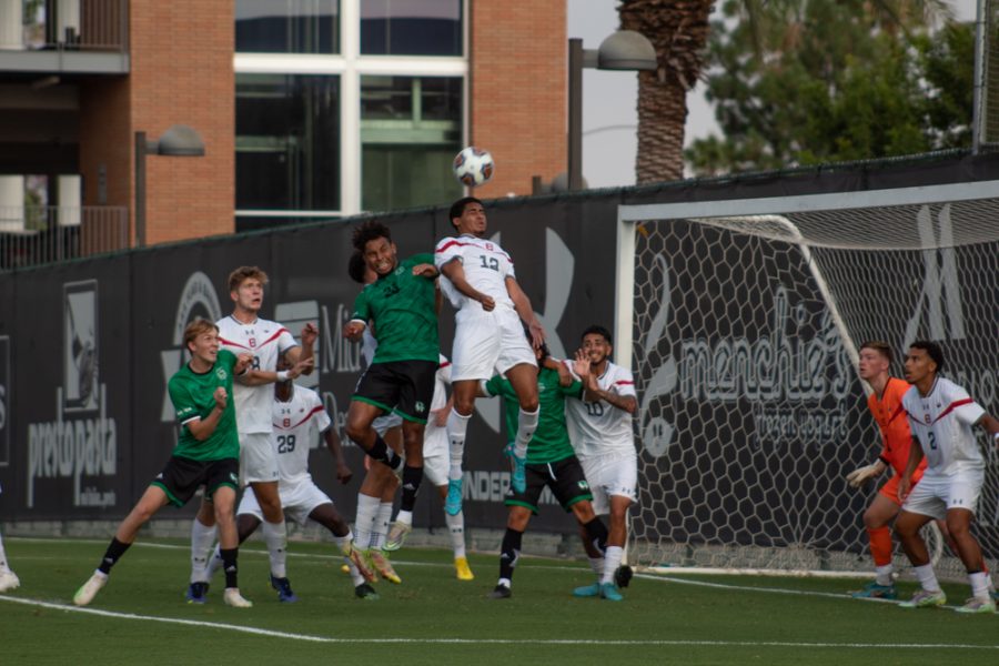 CSUN mens soccer player trying to defend the goal