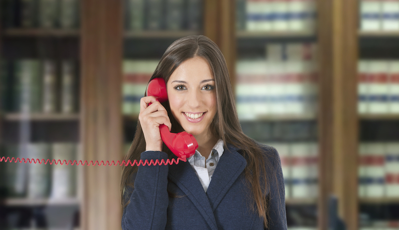 Business woman with vintage red phone