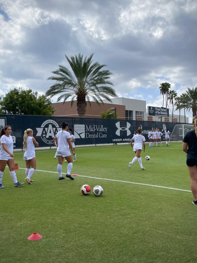 The Matadors warm up before their match against Portland State in Northridge, Calif., on Sunday, Sept. 18, 2022.