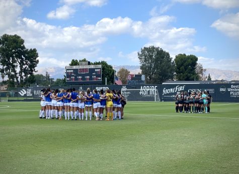 CSUN womens soccer team, left, and Portland State University womans soccer team huddle up before their game in Northridge, Calif., on Sunday, Sept. 18, 2022.