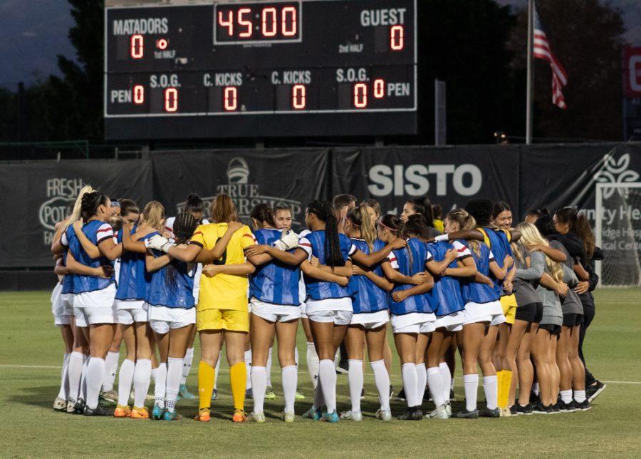 The+Matadors+womens+soccer+team+huddles+up+before+the+game+against+the+CSU+Fullerton+Titans+on+Sept.+22%2C+2022%2C+at+the+Performance+Soccer+Field+in+Northridge%2C+Calif.