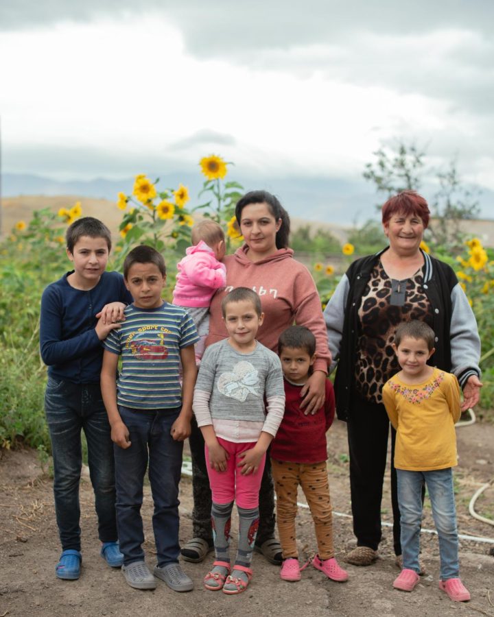 Asya, left, her mother, right, and six of Asya’s eight children in their backyard of Ishkhanasar, Syunik — where Azerbaijan shelled in their latest attack on Armenia. Asya and her eight children are safe and still in the village. 