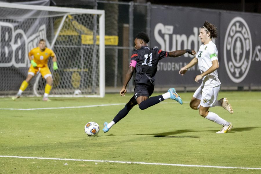 Matadors forward Jamar Ricketts, 11, moves to put the ball in a scoring position while Cal Poly San Luis Obispo defender Conner Leber, right, moves to block during a home game on the Performance Soccer Field on Wednesday, Oct. 12, 2022, in Northridge, Calif. The game ended in a 0-0 draw.