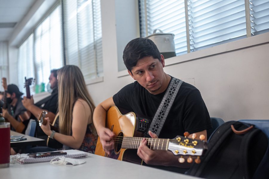 Student Christian Reichle plays the guitar in Music Therapy 360L on Sept. 29, 2022, in Northridge, Calif.