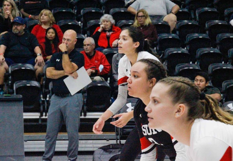 From right, Taylor Orshoff, Breanna Mitchell, Nicole Nevarez and CSUN head coach John Price concentrate on set three of the game against UC Davis on Friday, Oct. 14, 2022, at the Premier America Credit Union Arena in Northridge, Calif.