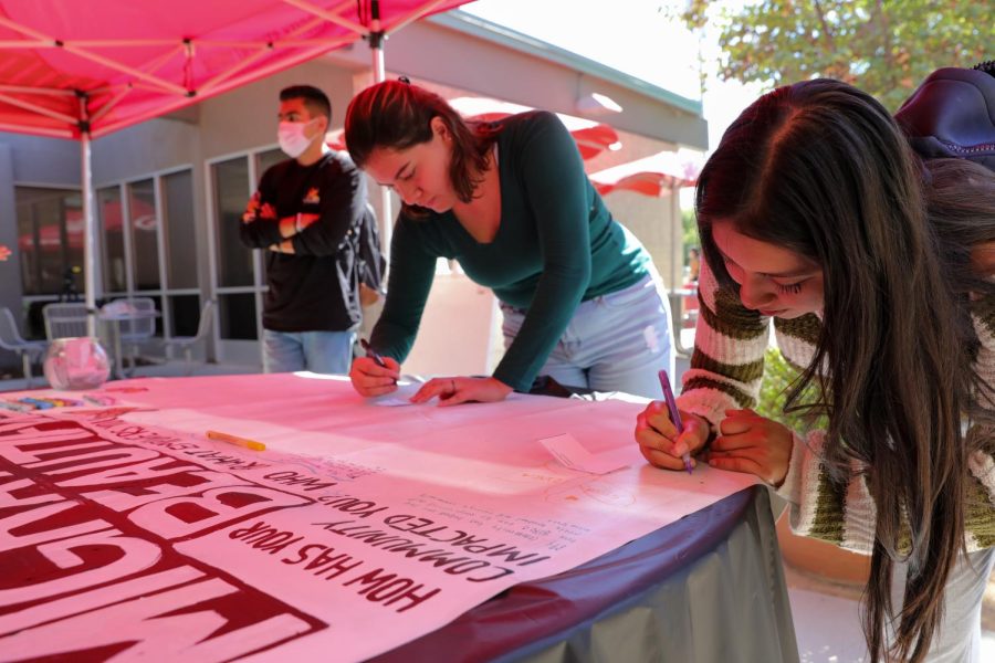 CSUN students draw on a mural in participation for the Undocumented Student Week of Action at CSUN in Northridge, Calif., on Oct. 17, 2022. CSUNs DREAM Center participated in the week-long event alongside other colleges in California.