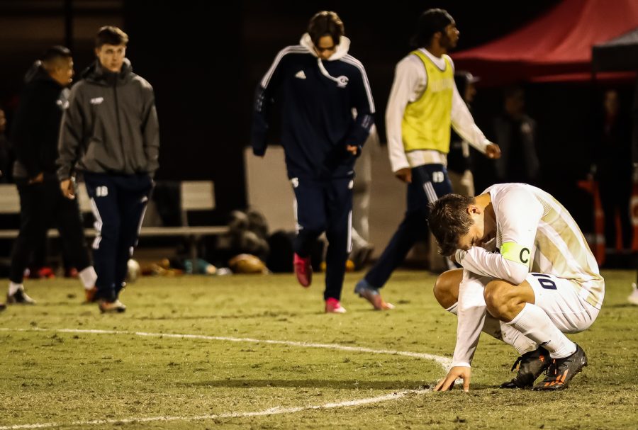 UC Davis mens soccer player crying after losing