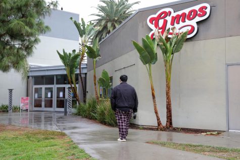 A student walks to Gmos buffet restaurant at CSUN in Northridge, Calif., on Monday, Nov. 7, 2022. Gmos is a rebrand of Geronimos, CSUNs buffet by the Student Housing Administration on campus.
