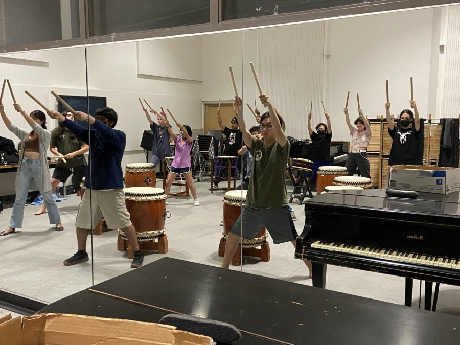 Jishin Taiko Ensemble members learn proper stance from co-directors Kyle Dang and Shaun Riel on Sept. 26, 2022, in Northridge, Calif.