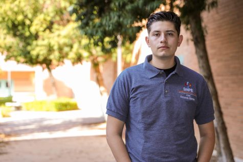 Fernando Barajas stands in front of the CSUN College of Engineering and Computer Science in Northridge, Calif., on Oct. 12, 2022. Barajas is the president of the Society of Hispanic Professional Engineers at CSUN.