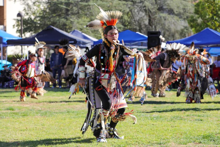 A woman dancing at the celebration of the native American culture