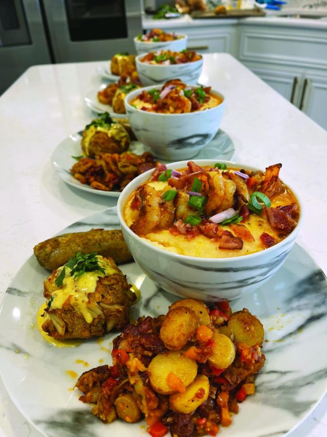 A plate of food, such as potato, and shrimp
